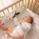 Foldebar stofbog med Moomin-illustreret stribe, brugt i tremmeseng ved baby