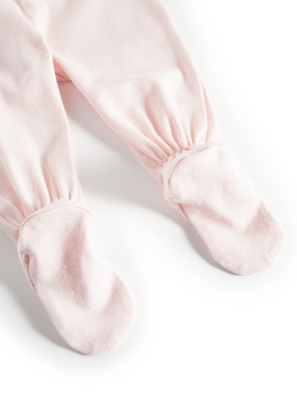 Rosa babybukser med rynkede manchetter ved anklerne