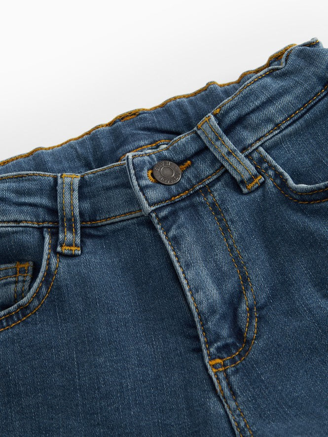 Pallas N jeans i mid indigo denim, knaplukning og bæltestropper