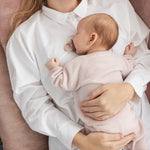Rosa mel kashmirbukser på baby, lange ben med ribkant ved anklen.