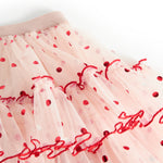 Lys rosa tyl-nederdel med elastik i taljen og røde prikker