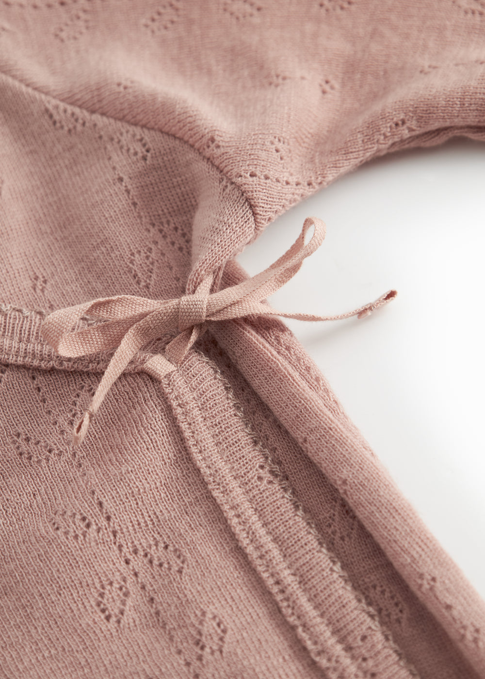 Uld pointelle bodystocking i støvet rosa med bindebånd foran