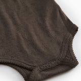 Uld bodystocking i brun med pointelle-strik og trykknapper ved benåbning