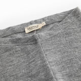 Gråmelerede uld leggings med pointelle-strik og elastisk linning, synlig mærkeetiket.