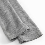 Gråmelerede uld leggings med let rynket kant ved benåbning.
