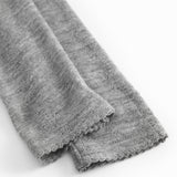 Gråmelerede uld leggings med let rynket kant ved benåbning.