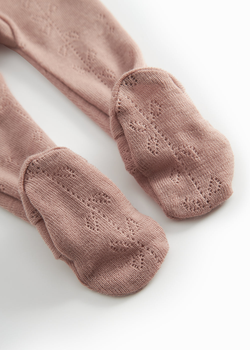 Uld pointelle-bukser i brændt rosa med ribstrikkede benender og hulmønster