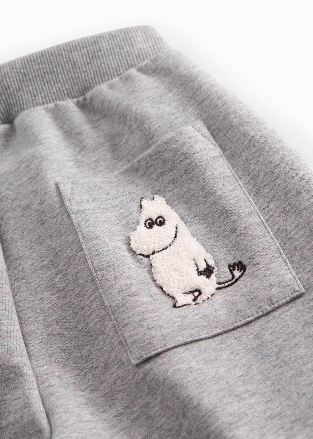 Grå sweatbukser til børn med Moomin print, elastik og bindebånd