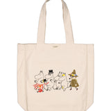Creme stofshoppetaske med Moomin-illustration på forsiden og lange bærehåndtag