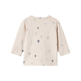 Børnebluse med lange ærmer i creme med ensartet blå ballondesign
