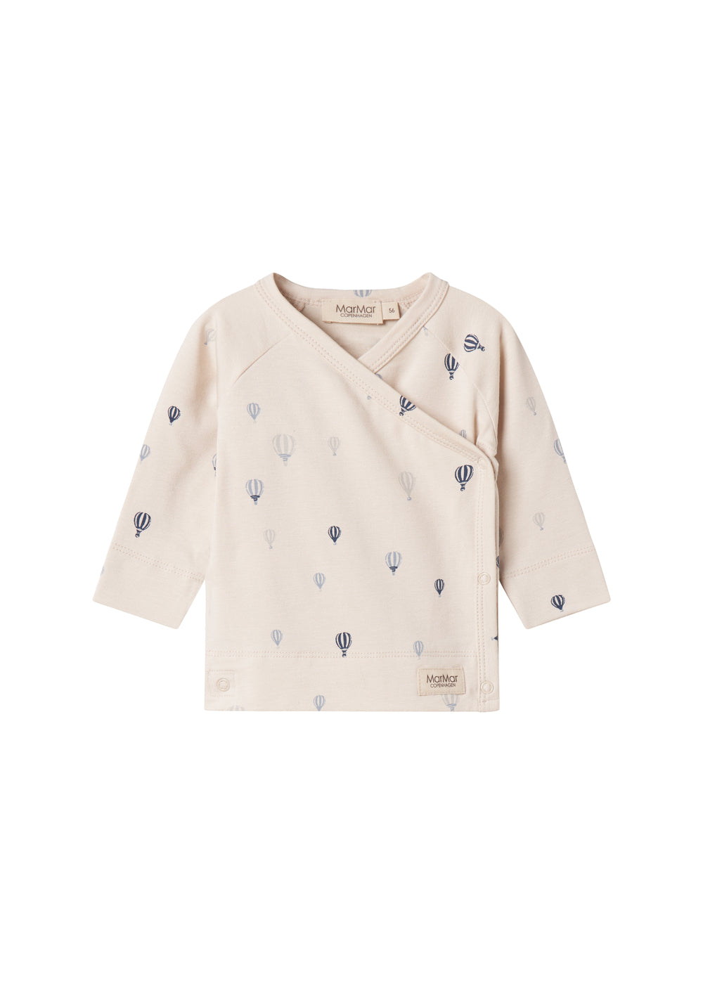 Børnebluse med lange ærmer i creme med små blå balloner og slå-om detalje