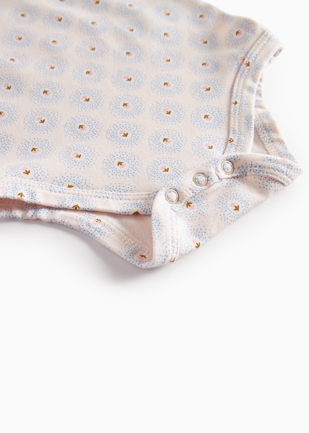 Bodystocking med trykknapper i skridt samt lille mønster af tulipaner
