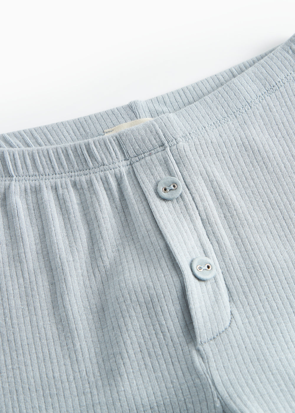 Lyseblå leggings med elastisk linning og knapdetaljer