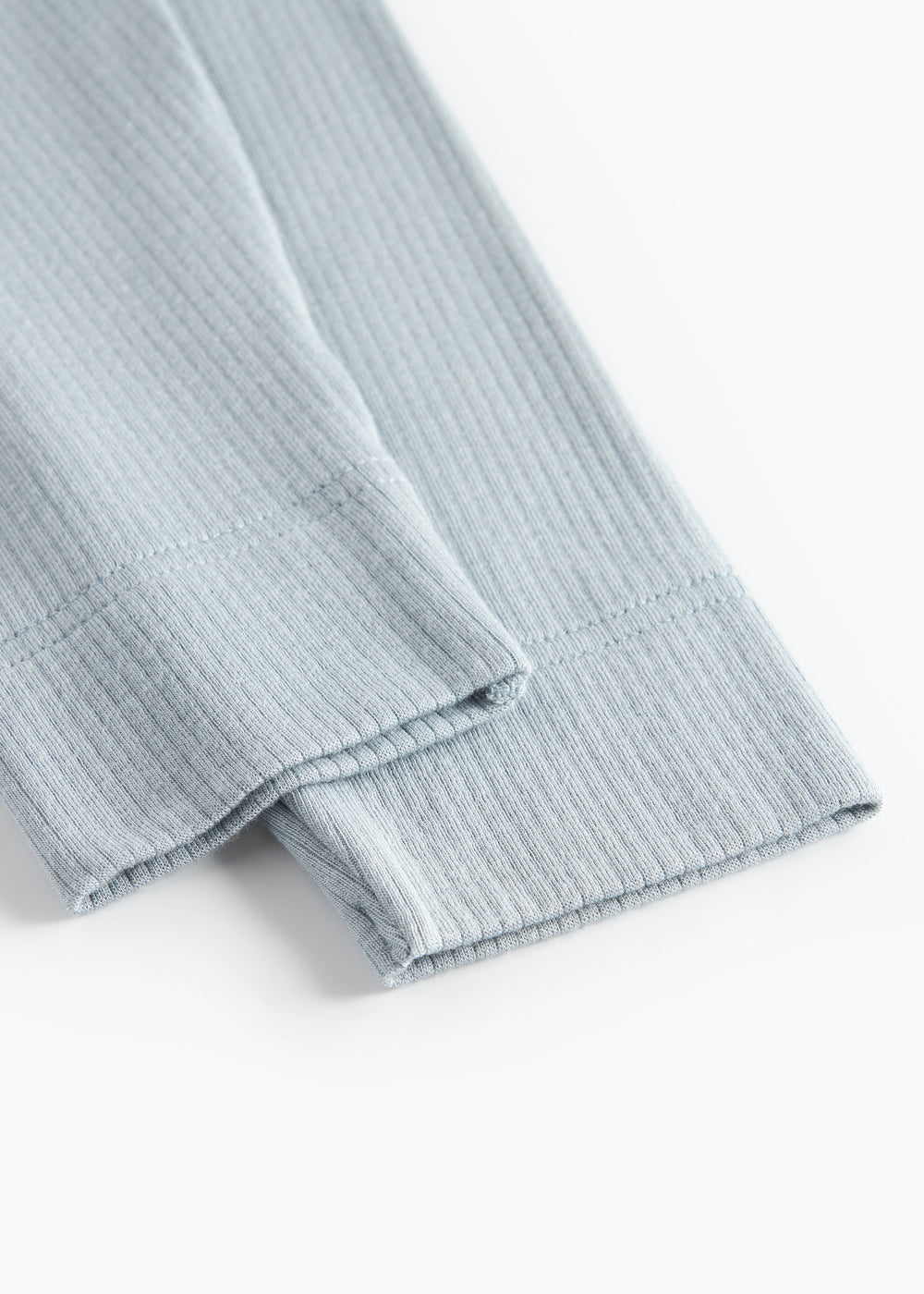 Lyseblå leggings med ribbet stof og foldet nederkant