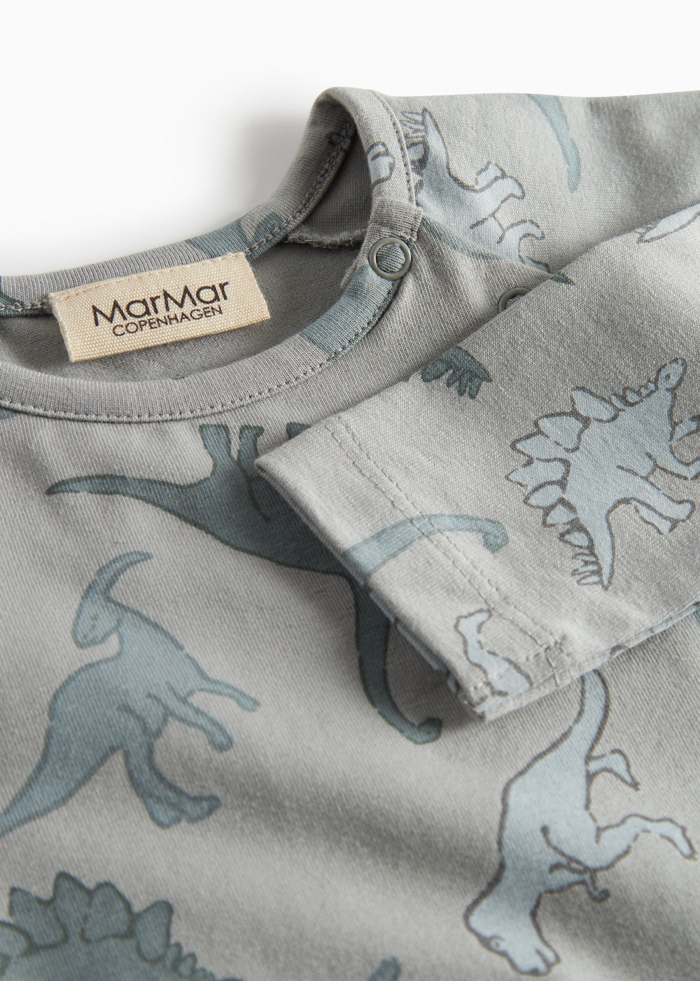 Grå bodystocking med dino-print og knaplukning ved halsudskæring