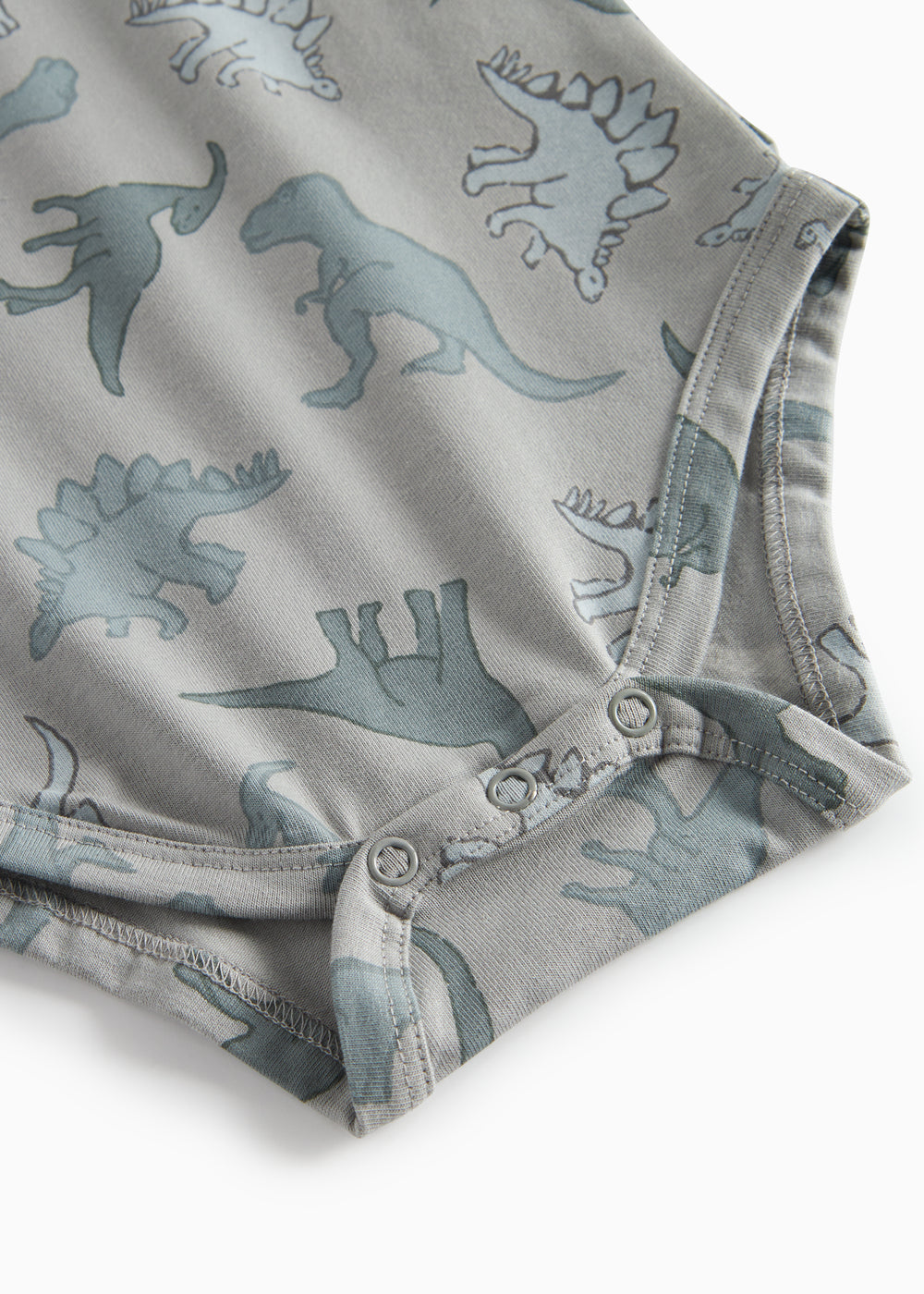 Grå bodystocking med dino-print og trykknapper ved benåbning