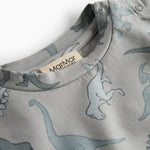 Dinosaurbluse med rund hals og synlig nakkeetiket, lysegrå dino-print