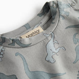 Dinosaurbluse med rund hals og synlig nakkeetiket, lysegrå dino-print