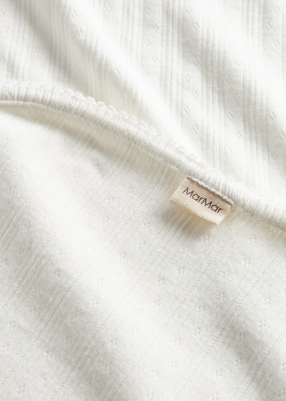 Hvid pointelle babyteppe