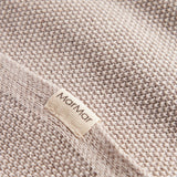 Beige strikket babytæppe