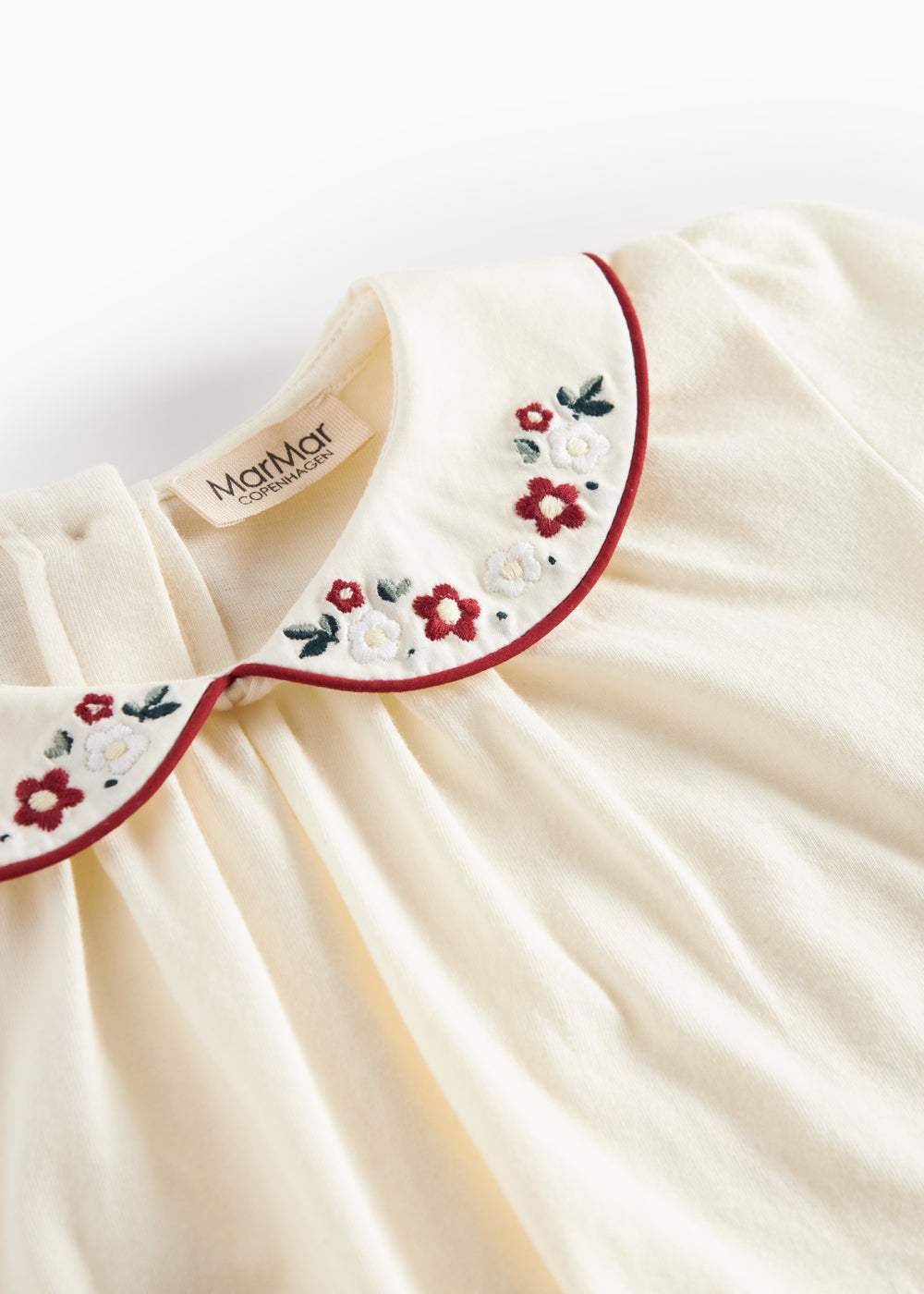 Hvud festbluse med hvid krave og små blomsterbroderier til børn