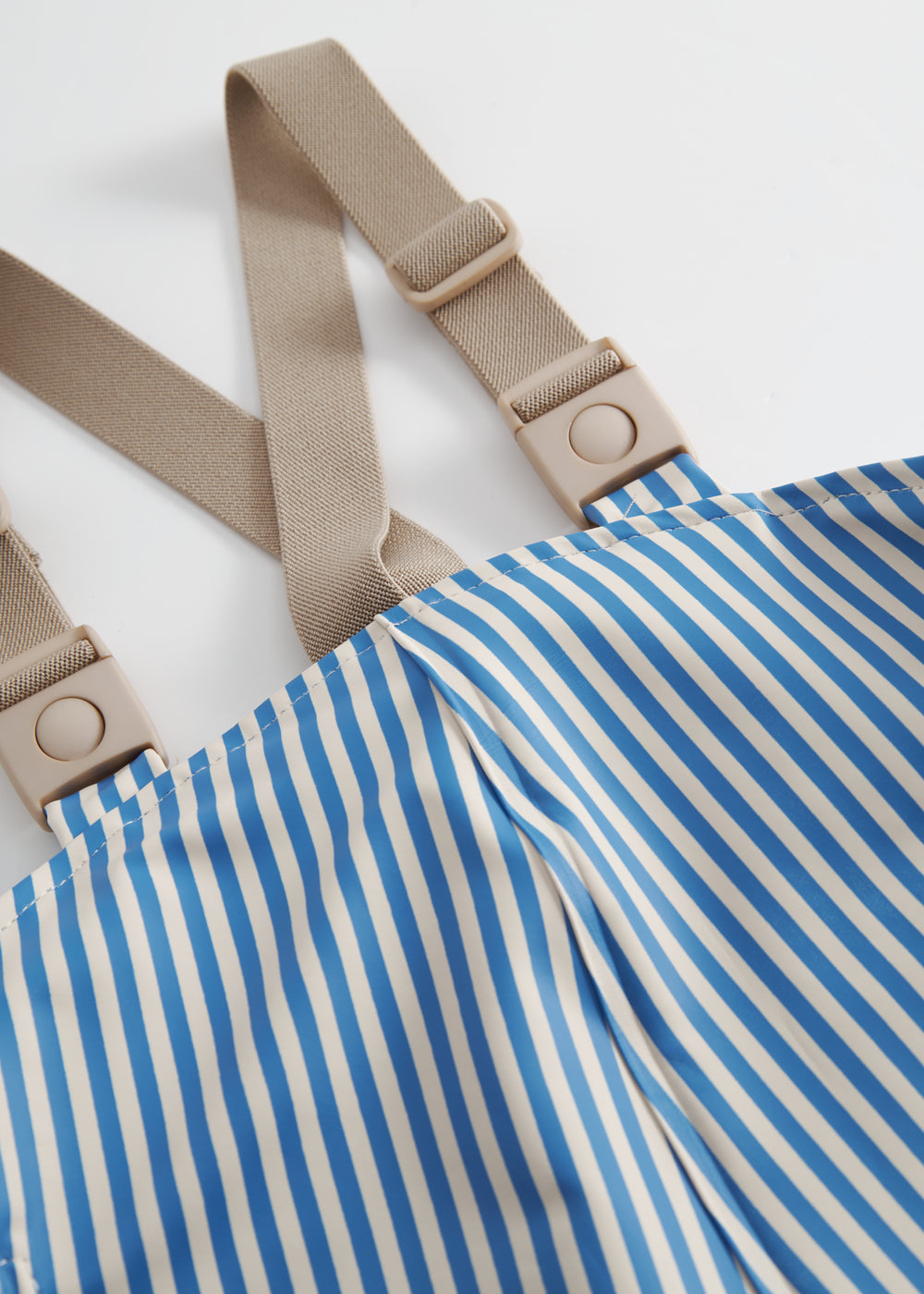 Blå stribet regnbukser med seler og fodstropper til børn