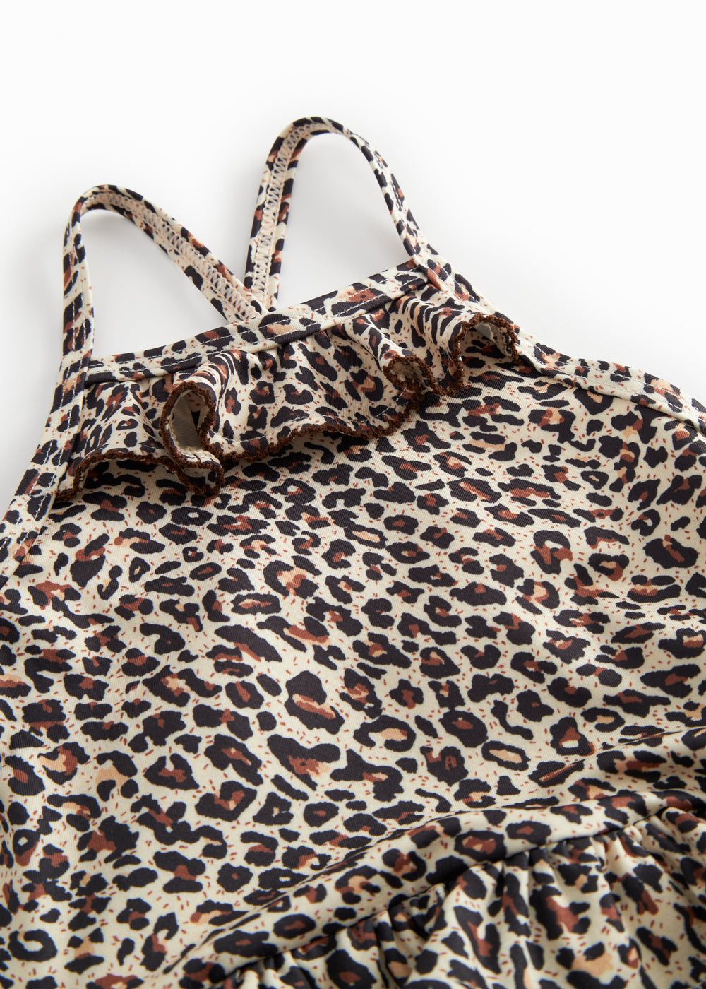 Badedragt til barn med leopardmønster, smalle stropper og flæse foran