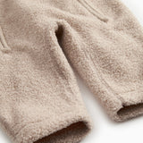 Beige teddyfleece heldragt med blød, tæt plysstruktur