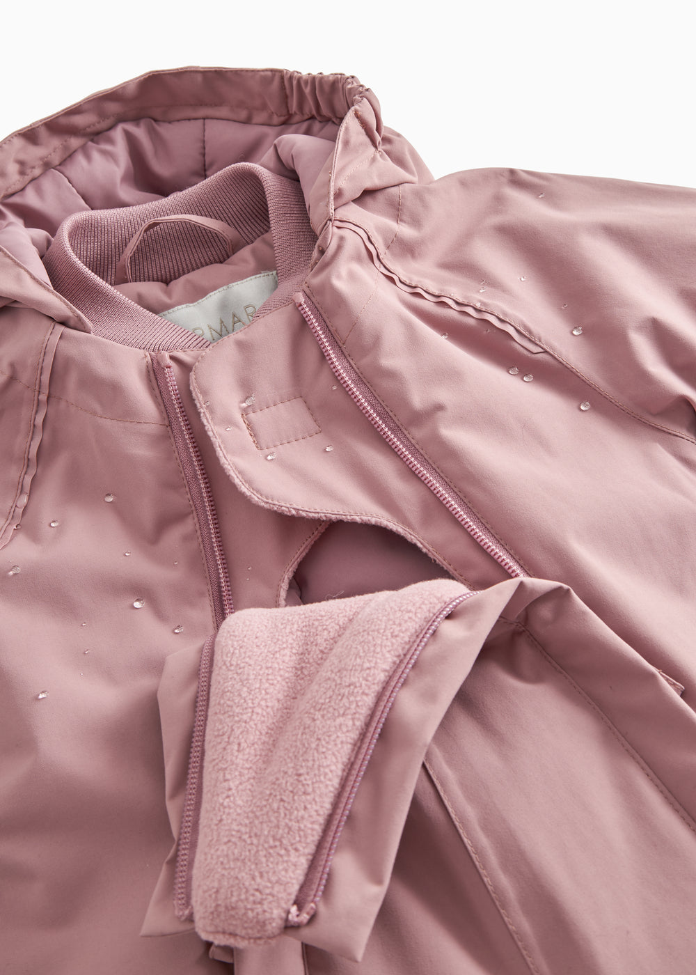 Rosa flyverdragt med lynlås og fleece-/uldmanchet ved håndleddet