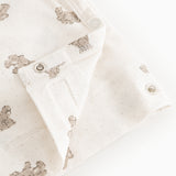 Offwhite wrap-bluse med lange ærmer, teddybjørneprint og trykknapper ved halsen