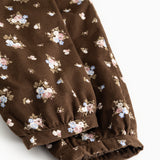 Brune bukser med små blomsterprint og elastisk benåbning