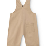 Beige selebukser til baby med brystlomme og ben med korte længder.