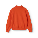 Orange strikpolo til børn med ribkant ved nederkant og ærmer (bag)