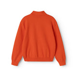 Orange strikpolo til børn med ribkant ved nederkant og ærmer (bag)