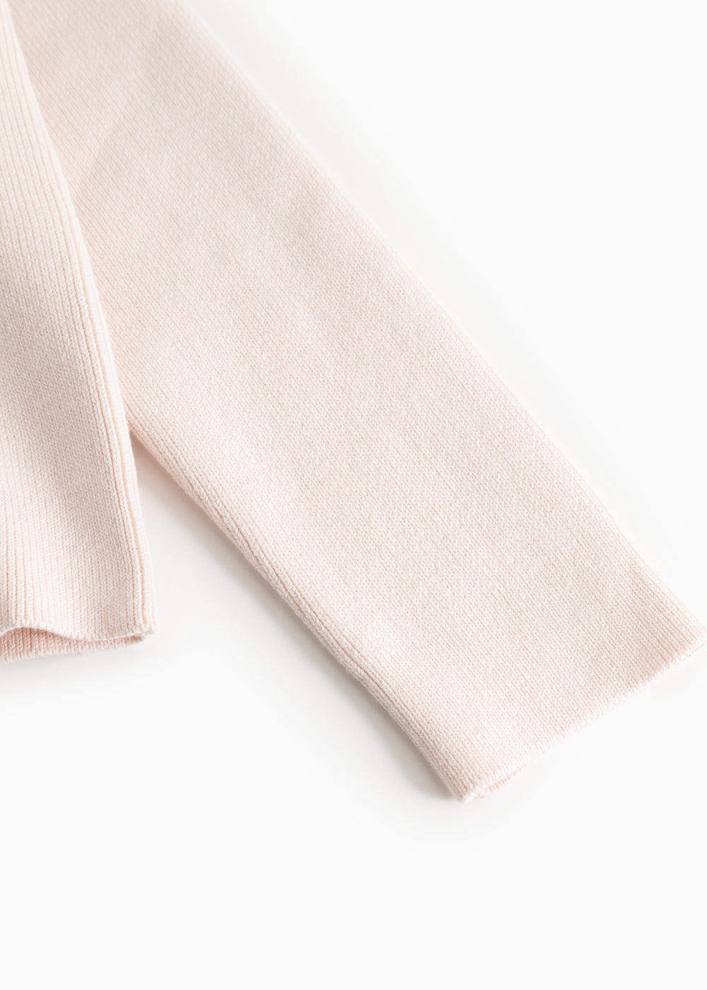 Lyserosa strikket cardigan-ærme med ribkant ved håndled