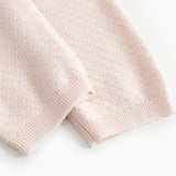 Pira strikbukser i rosa, ribkant ved benåbning, tæt på